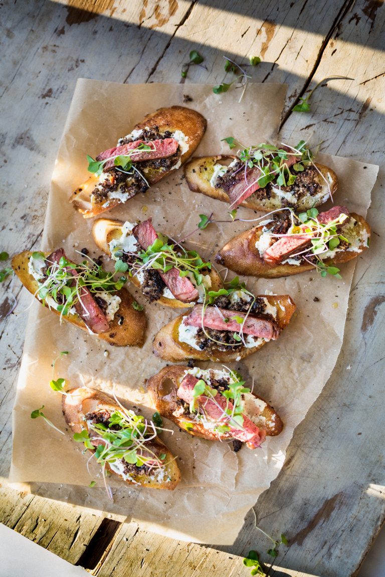 Tenderloin Crostini with Herbed Goat Cheese, Mushroom Duxelles, Micro Greens, and Citronette