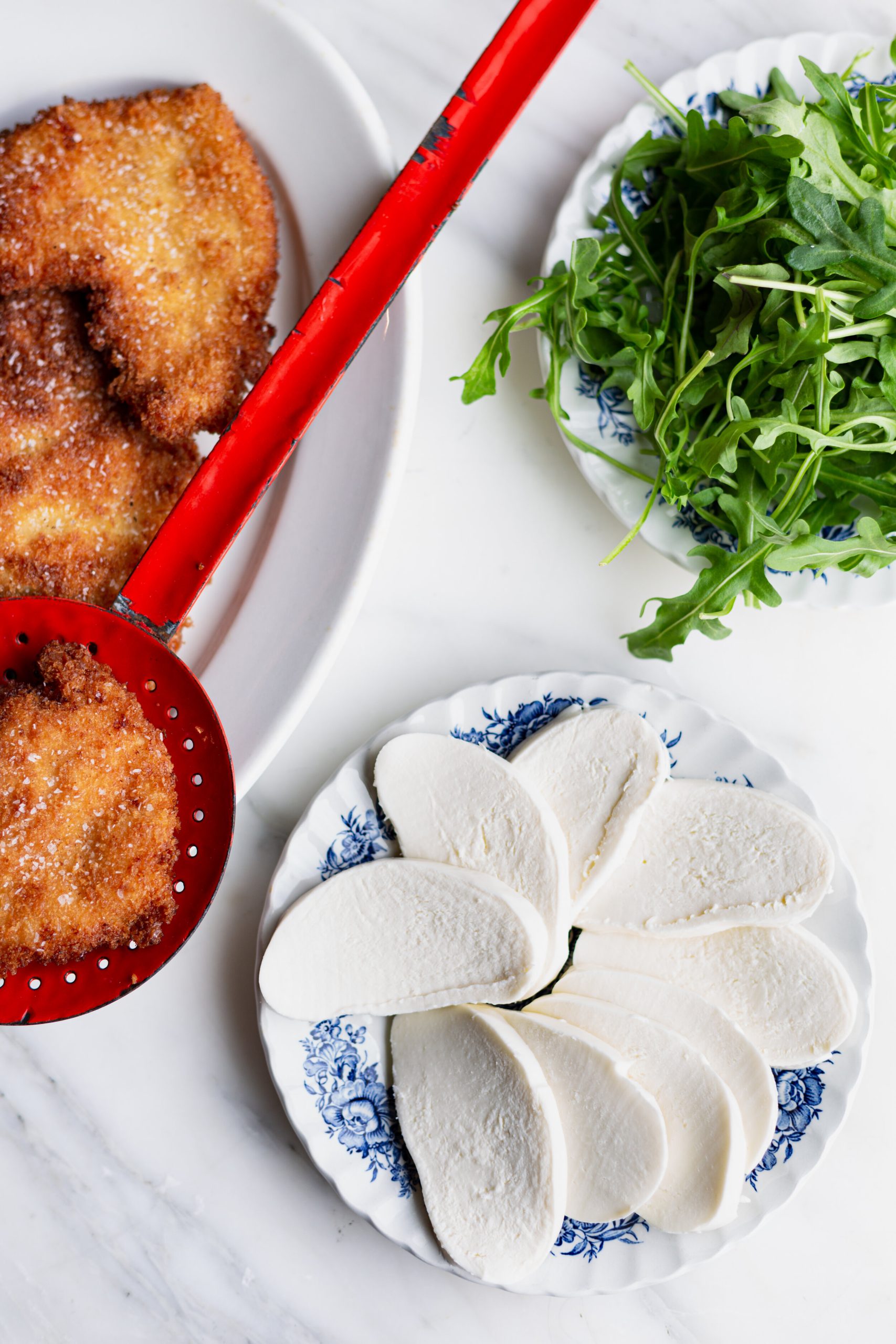 Crispy Chicken Parm Sandwich ingredients on a table.