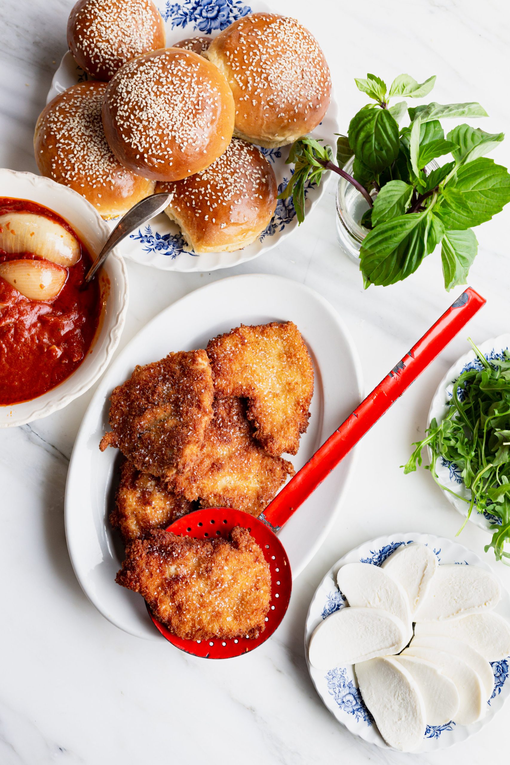 Crispy Chicken Parm Sandwich ingredients on a table.