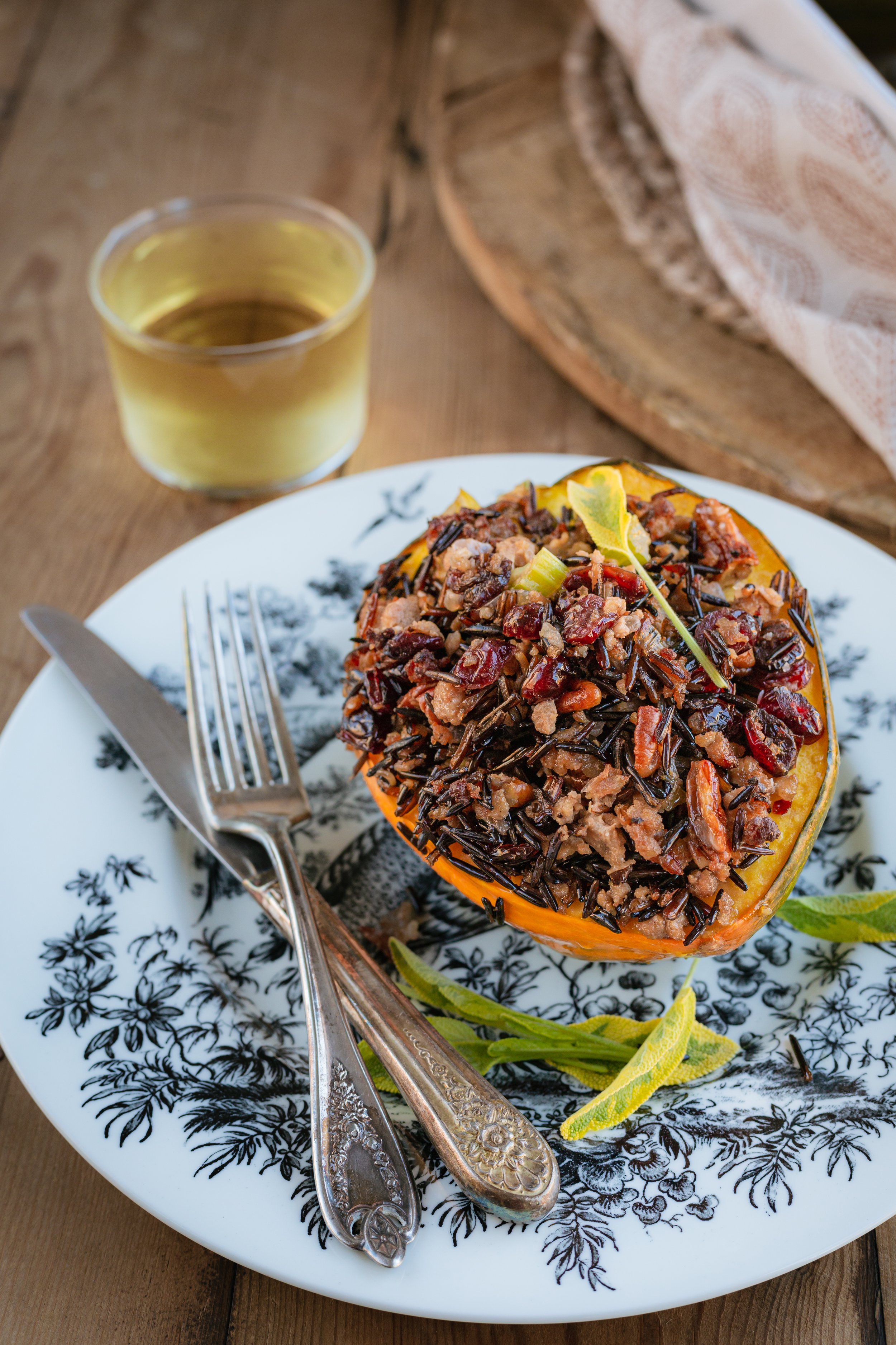 Sausage and Wild Rice Stuffed Acorn Squash on a plate.