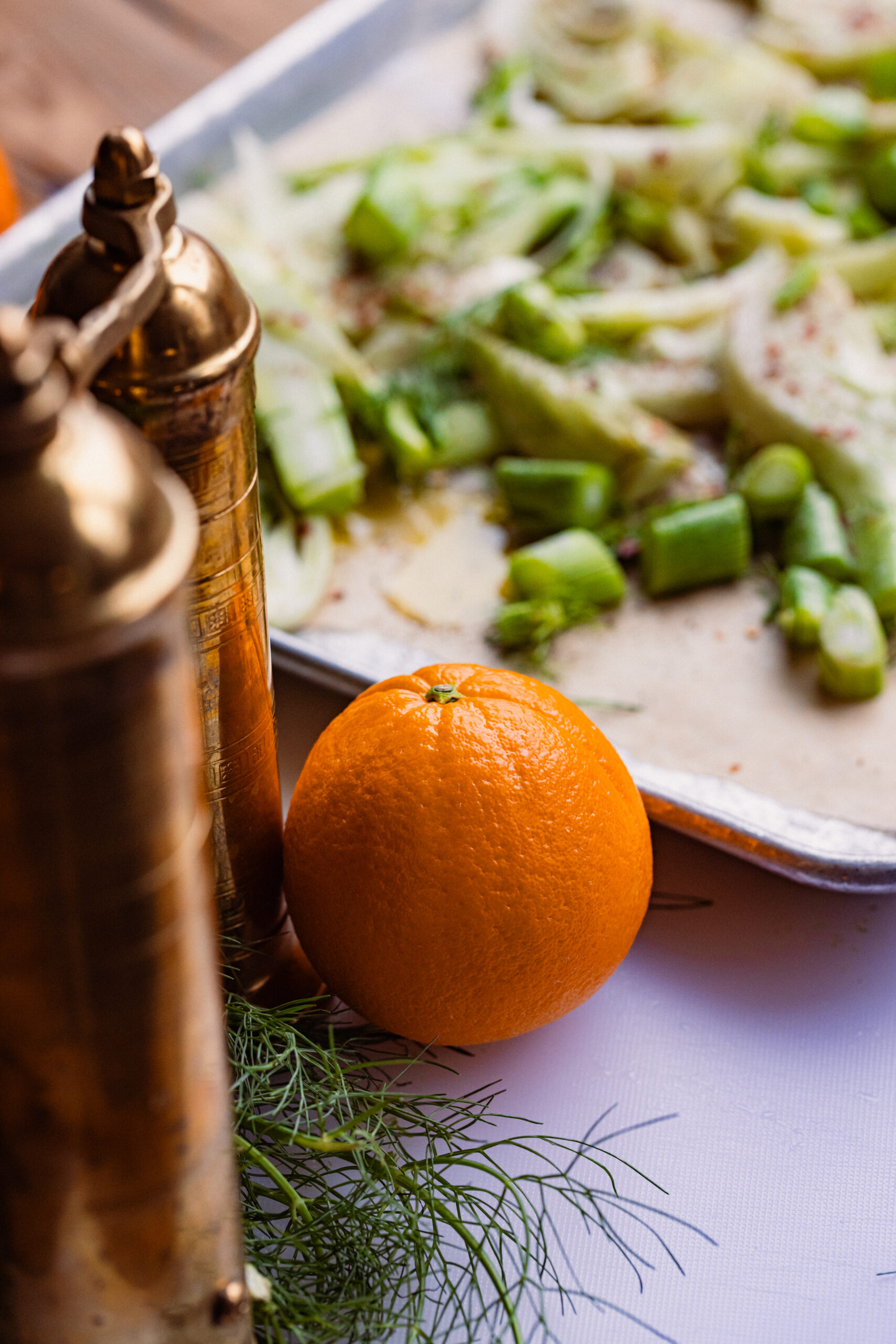 Diced fennel and an orange on a table.