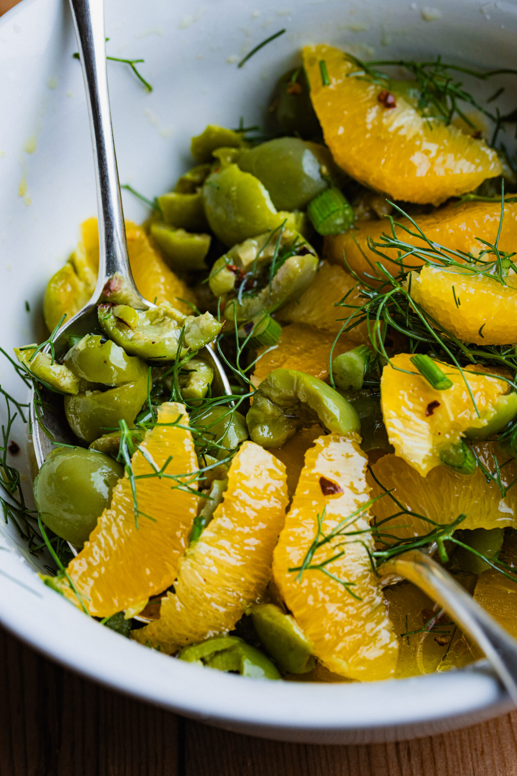 Olives, orange, and fennel in a bowl.